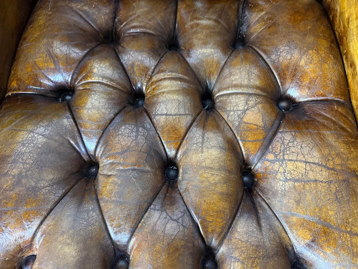 Pair of Italian Leather Tufted Armchairs w/ Cherubs