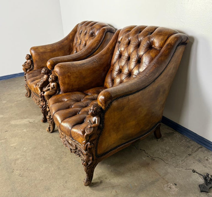 Pair of Italian Leather Tufted Armchairs w/ Cherubs