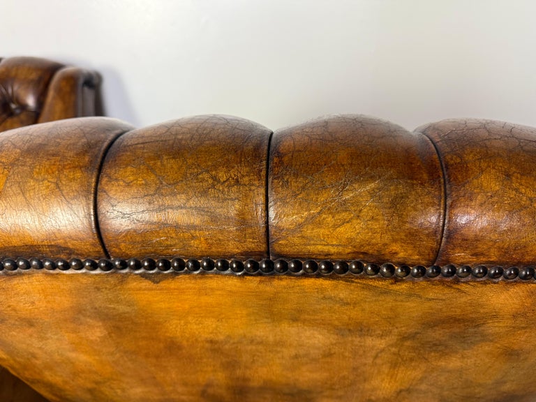 Pair of Italian Leather Tufted Armchairs w/ Cherubs