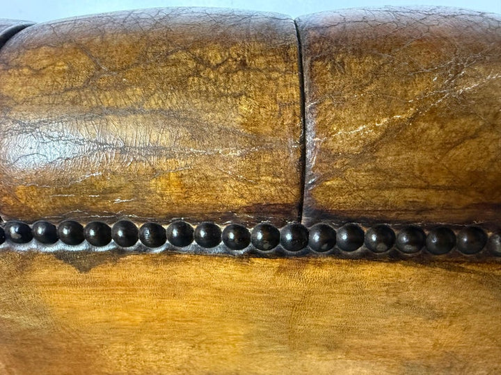 Pair of Italian Leather Tufted Armchairs w/ Cherubs