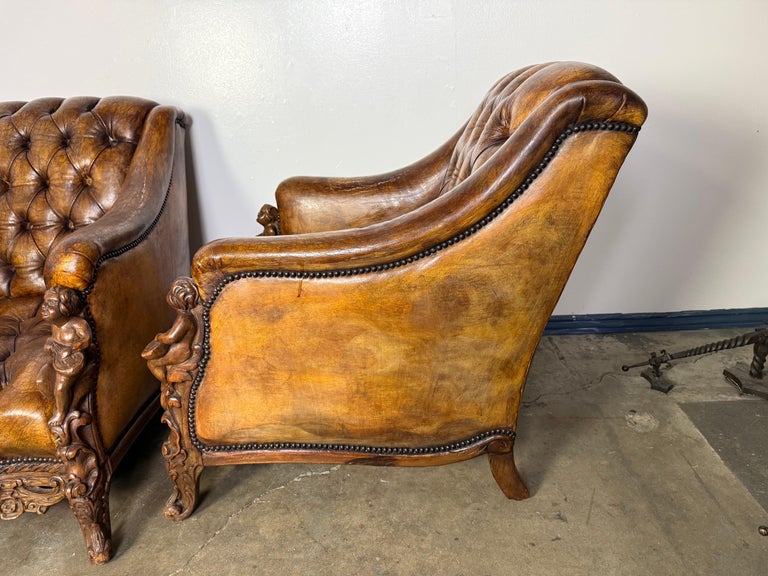 Pair of Italian Leather Tufted Armchairs w/ Cherubs