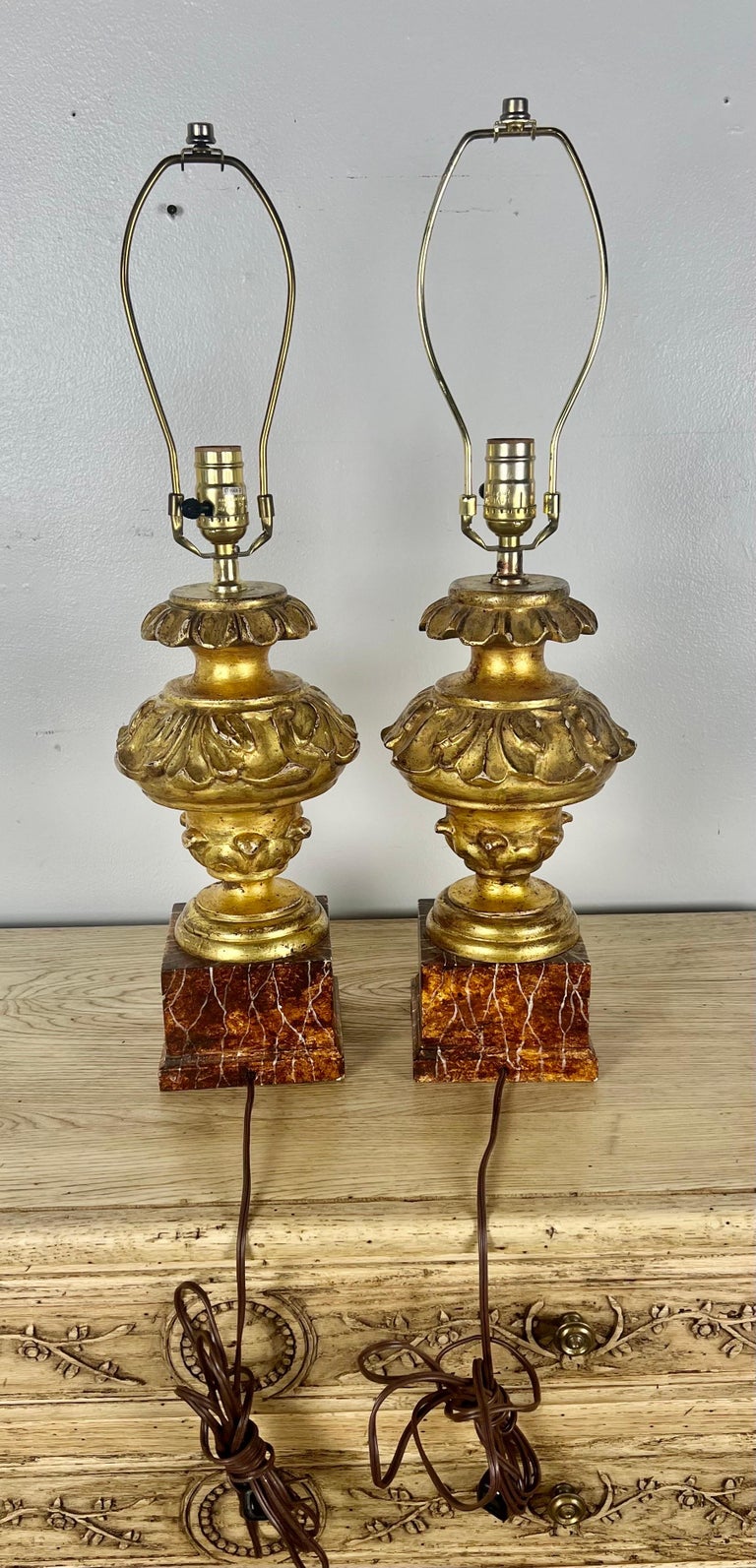 Pair of Italian Gilt Wood Carved Lamps on Faux Marble Bases