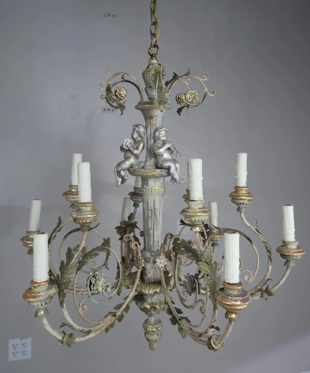 Twelve-Light Italian Wood and Iron Cherub Trio Chandelier,  $4,800 each/ not for the pair