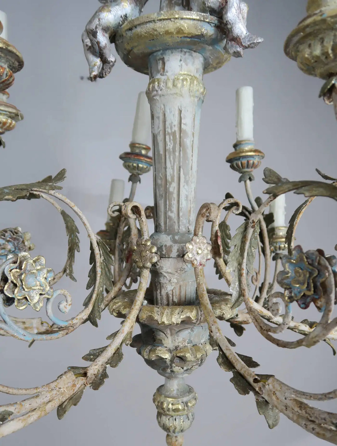 Twelve-Light Italian Wood and Iron Cherub Trio Chandelier,  $4,800 each/ not for the pair