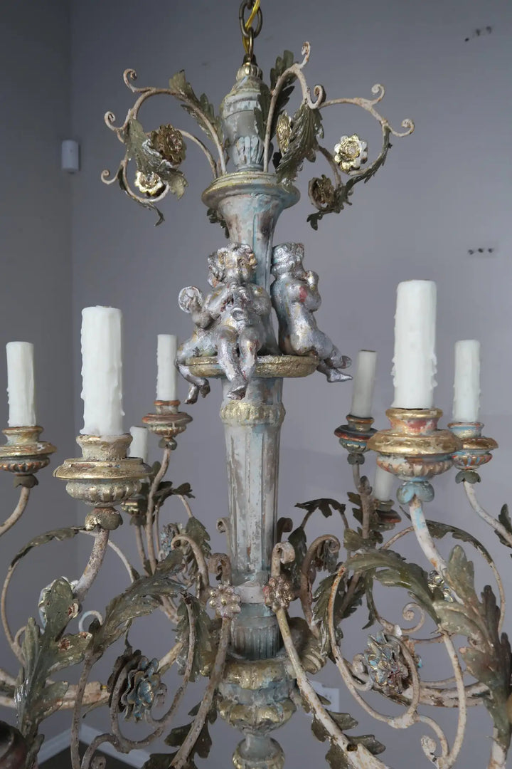 Twelve-Light Italian Wood and Iron Cherub Trio Chandelier,  $4,800 each/ not for the pair