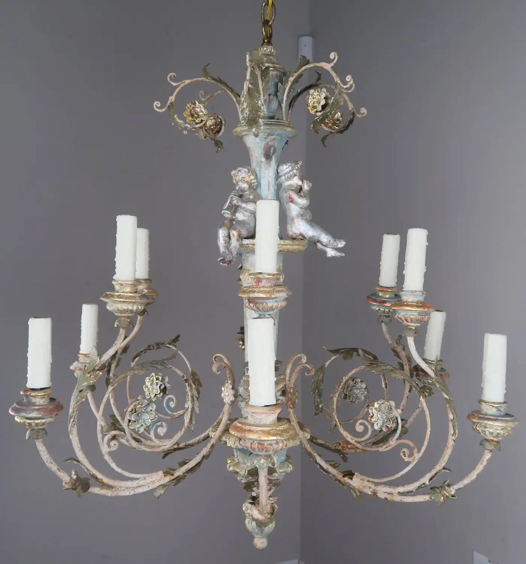 Twelve-Light Italian Wood and Iron Cherub Trio Chandelier,  $4,800 each/ not for the pair