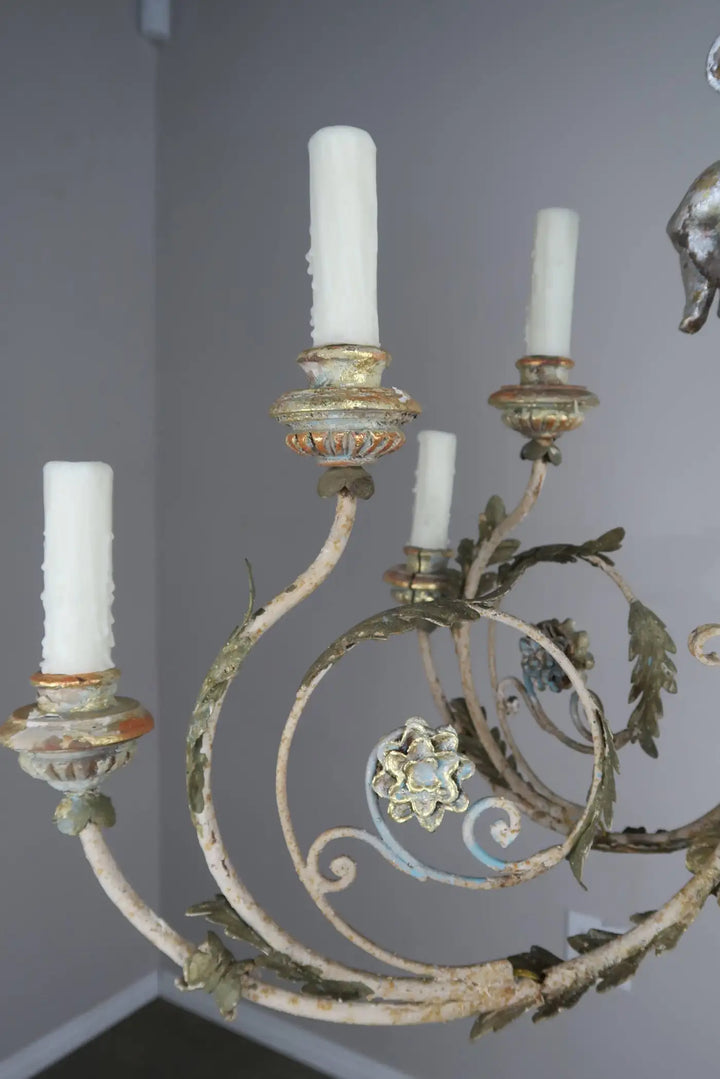 Twelve-Light Italian Wood and Iron Cherub Trio Chandelier,  $4,800 each/ not for the pair