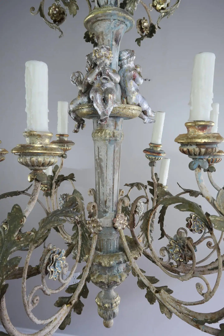 Twelve-Light Italian Wood and Iron Cherub Trio Chandelier,  $4,800 each/ not for the pair