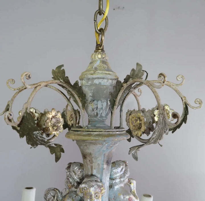 Twelve-Light Italian Wood and Iron Cherub Trio Chandelier,  $4,800 each/ not for the pair