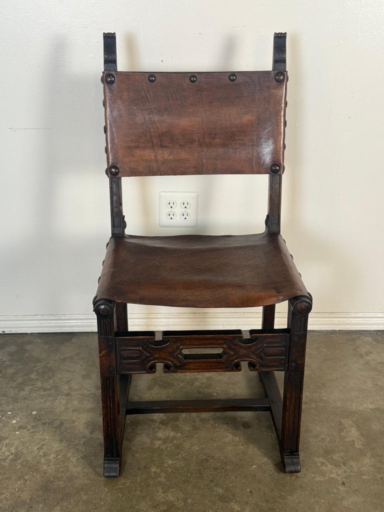 Set of Six Spanish Revival Leather and Carved Wood Armchairs
