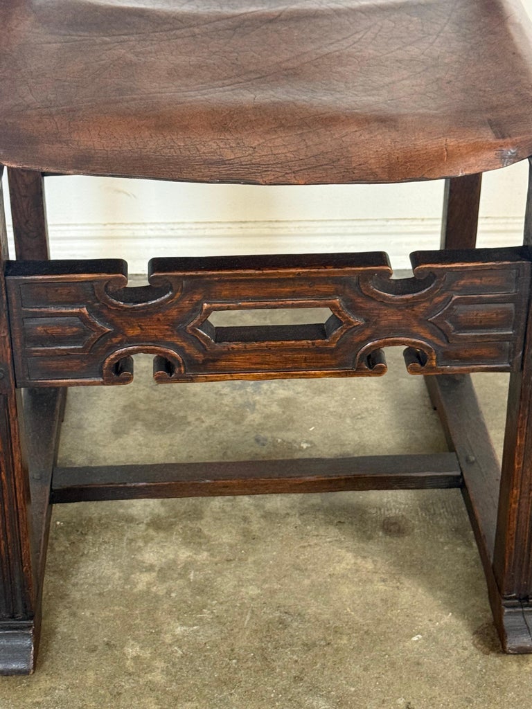 Set of Six Spanish Revival Leather and Carved Wood Armchairs