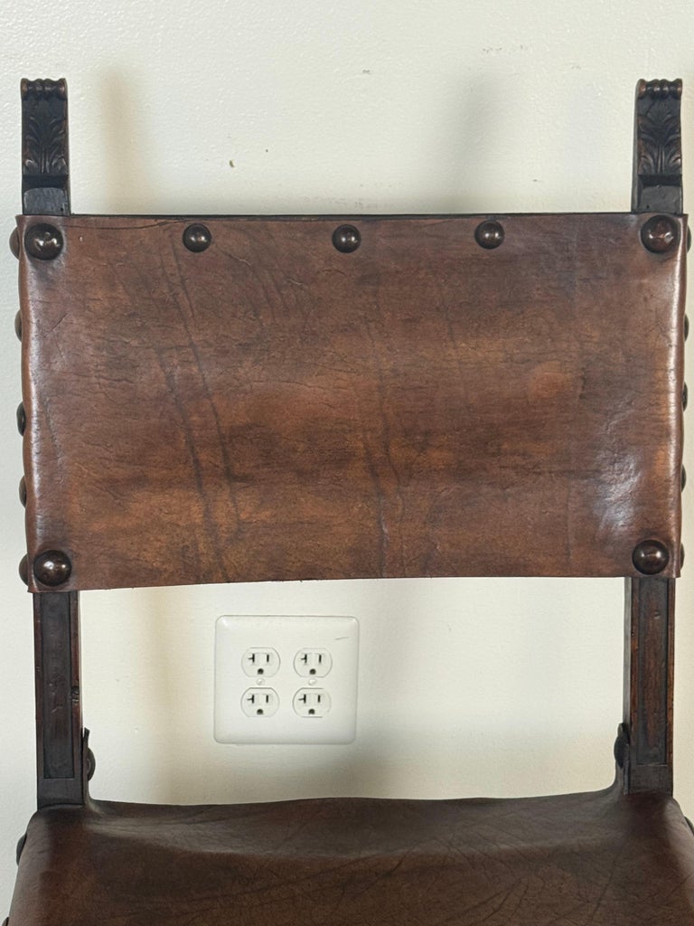 Set of Six Spanish Revival Leather and Carved Wood Armchairs