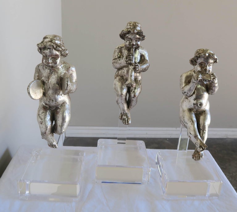 Set of Three Silver Gilt Musical Cherubs on Lucite Bases