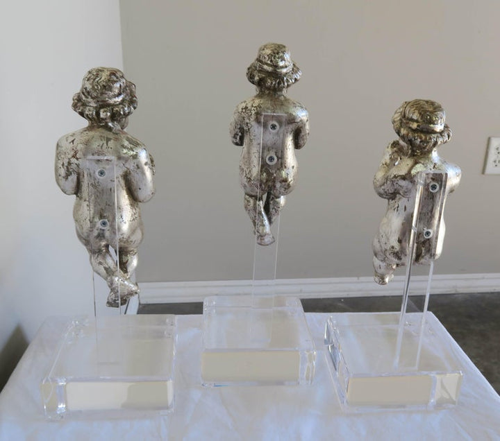 Set of Three Silver Gilt Musical Cherubs on Lucite Bases