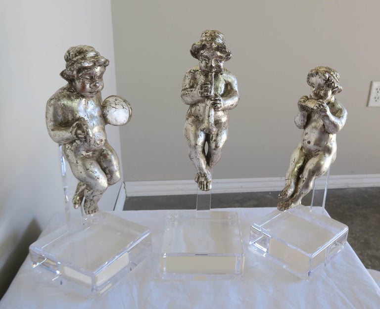 Set of Three Silver Gilt Musical Cherubs on Lucite Bases