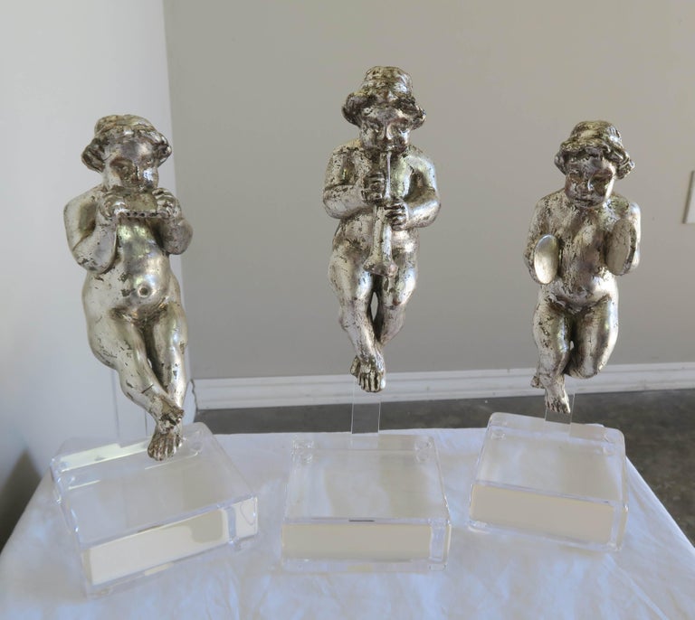 Set of Three Silver Gilt Musical Cherubs on Lucite Bases