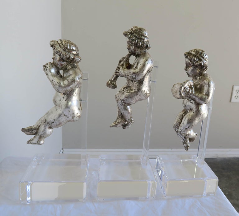 Set of Three Silver Gilt Musical Cherubs on Lucite Bases