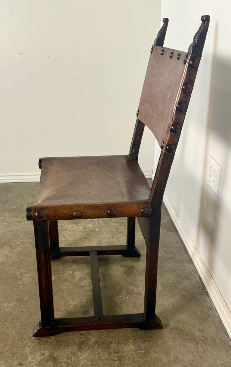 Set of Six Spanish Revival Leather and Carved Wood Armchairs