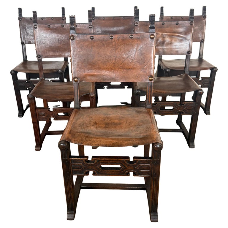 Set of Six Spanish Revival Leather and Carved Wood Armchairs