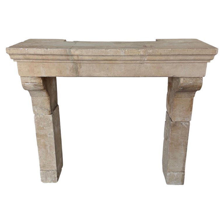 Petite 18th Century French Limestone Fireplace Mantel With Scrolled Corbels