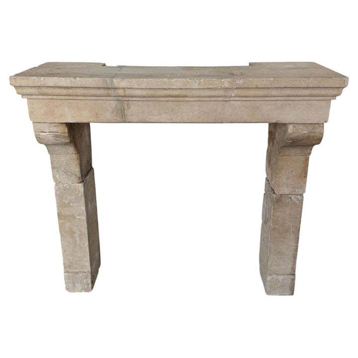 Petite 18th Century French Limestone Fireplace Mantel With Scrolled Corbels