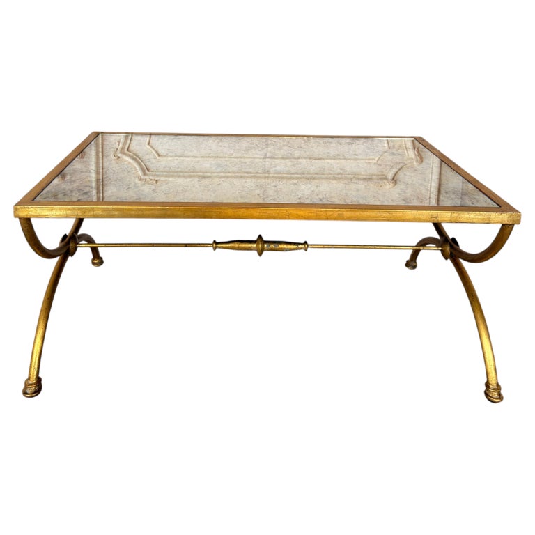 Curule Gilt Iron Coffee Table with Antiqued Mirror Top by Miamar Home
