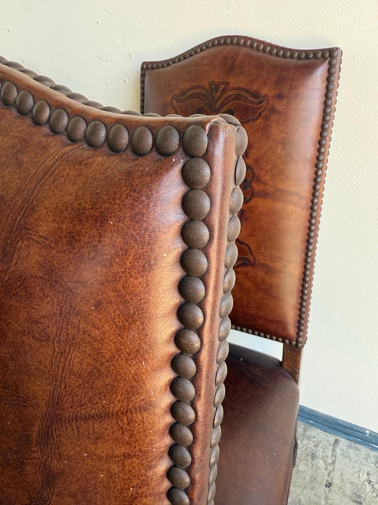 Set of Eight Spanish Revival Leather and Carved Walnut Dining Chairs