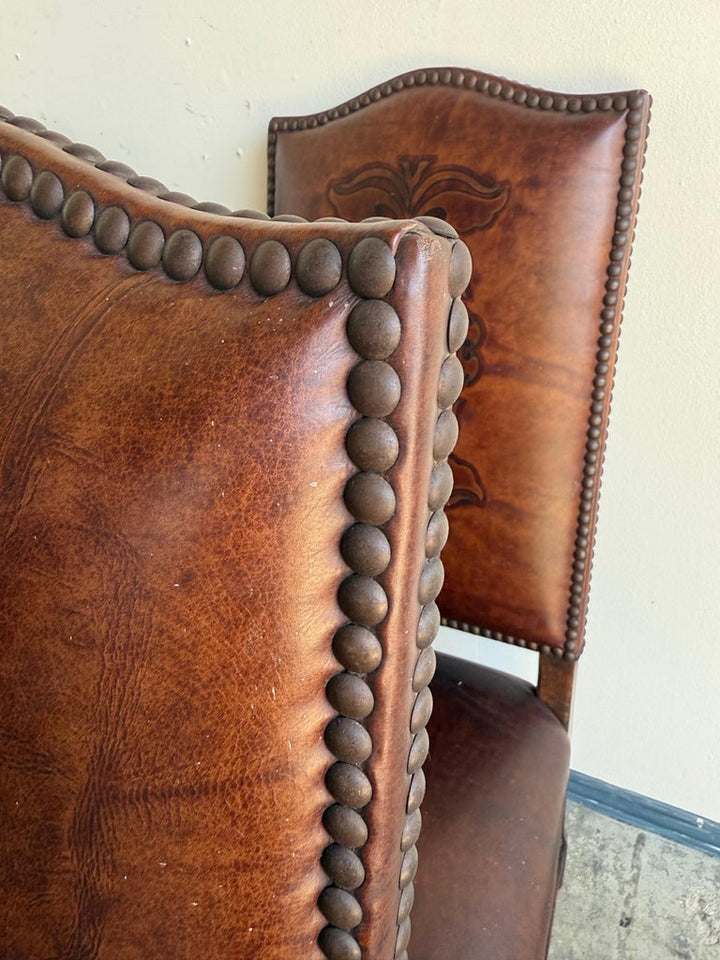 Set of Eight Spanish Revival Leather and Carved Walnut Dining Chairs