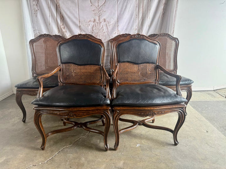 Eight French Provincial-style dining chairs