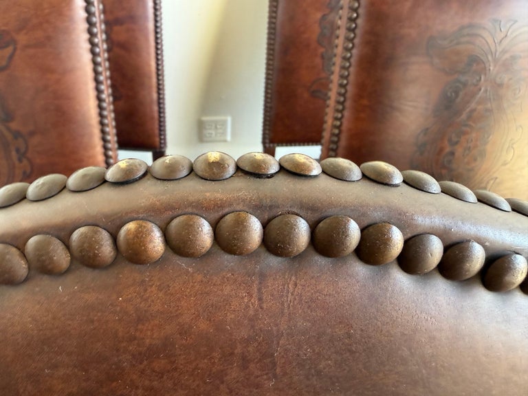 Set of Eight Spanish Revival Leather and Carved Walnut Dining Chairs