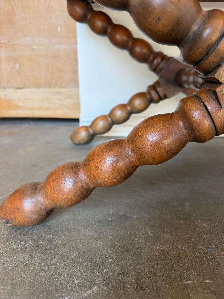 Pair of Spanish Colonial Baroque Bobbin - X-Base Stools with Distressed Leather