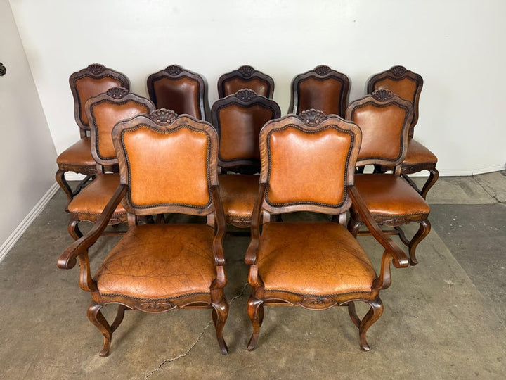 Set of Eight French Carved Wood Dining Chairs with Leather Upholstery