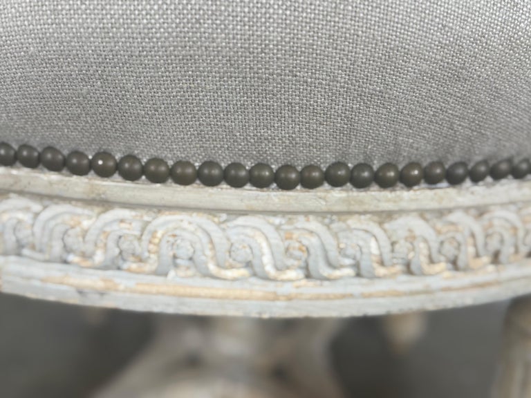 French Neoclassical upholstered ottoman, early 20th century.