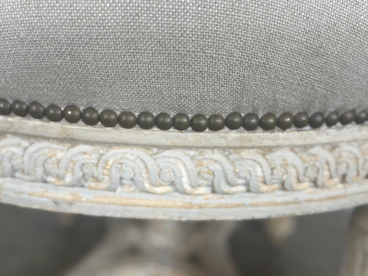 French Neoclassical upholstered ottoman, early 20th century.