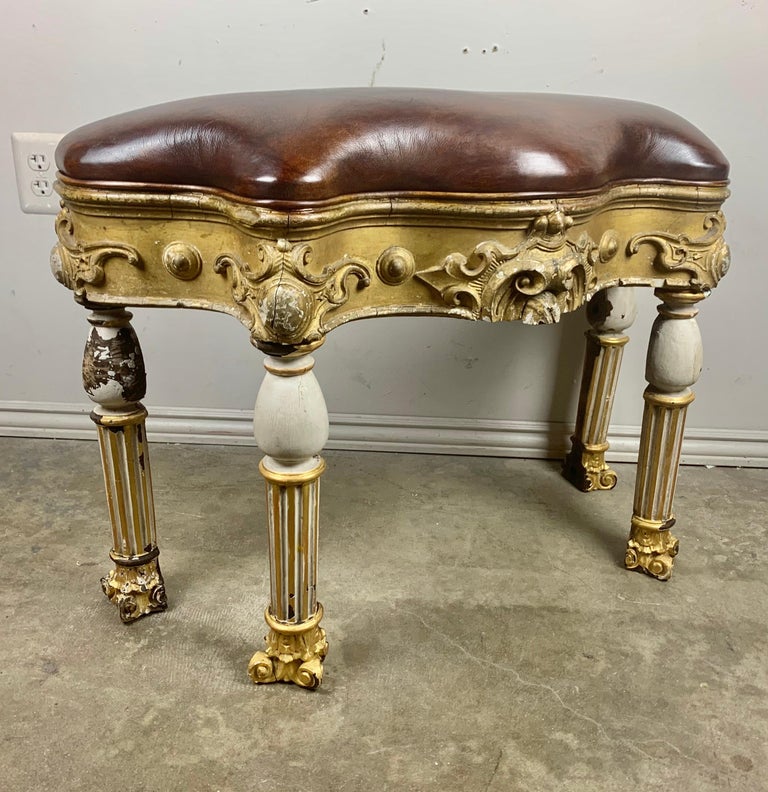 Italian Painted and Parcel Gilt Leather Bench