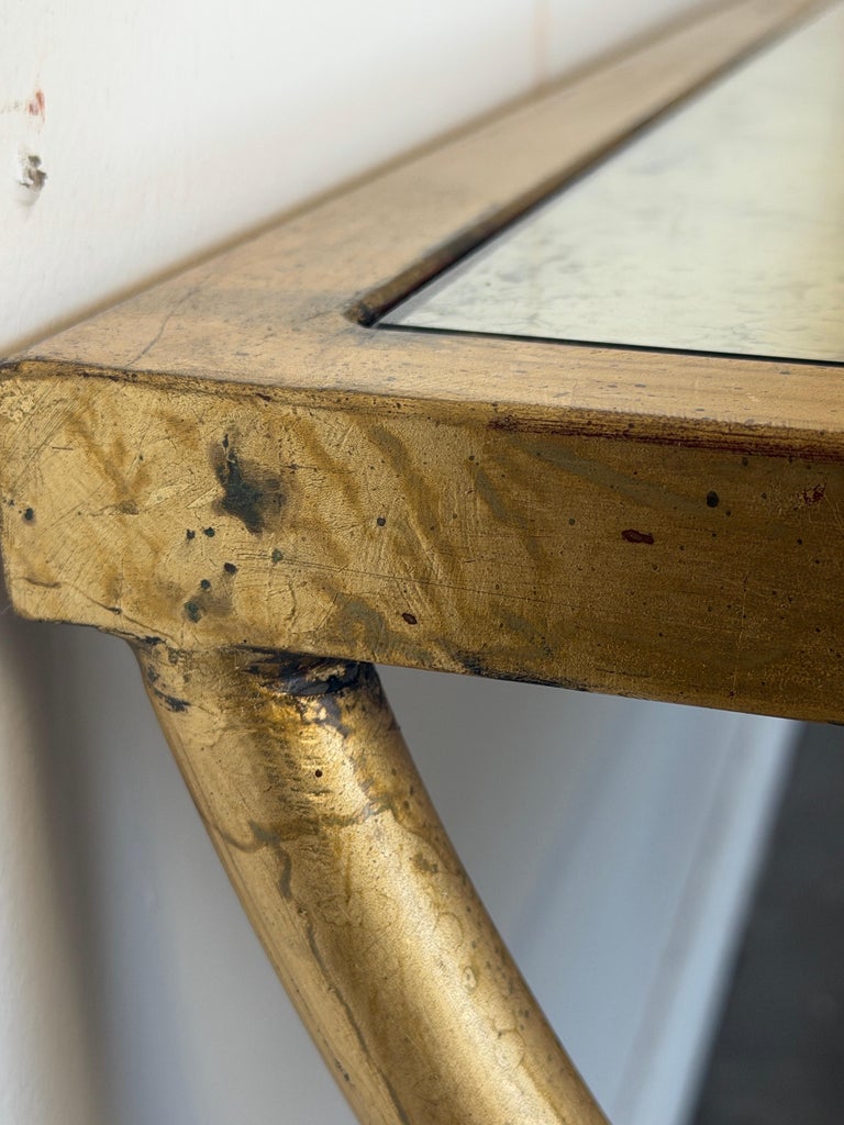Curule Gilt Iron Coffee Table with Antiqued Mirror Top by Miamar Home