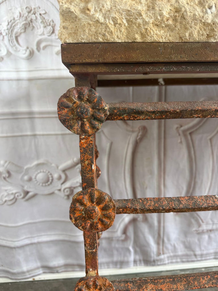 Rustic Console Table with Textured Stone Top and Hand-Forged Iron Base