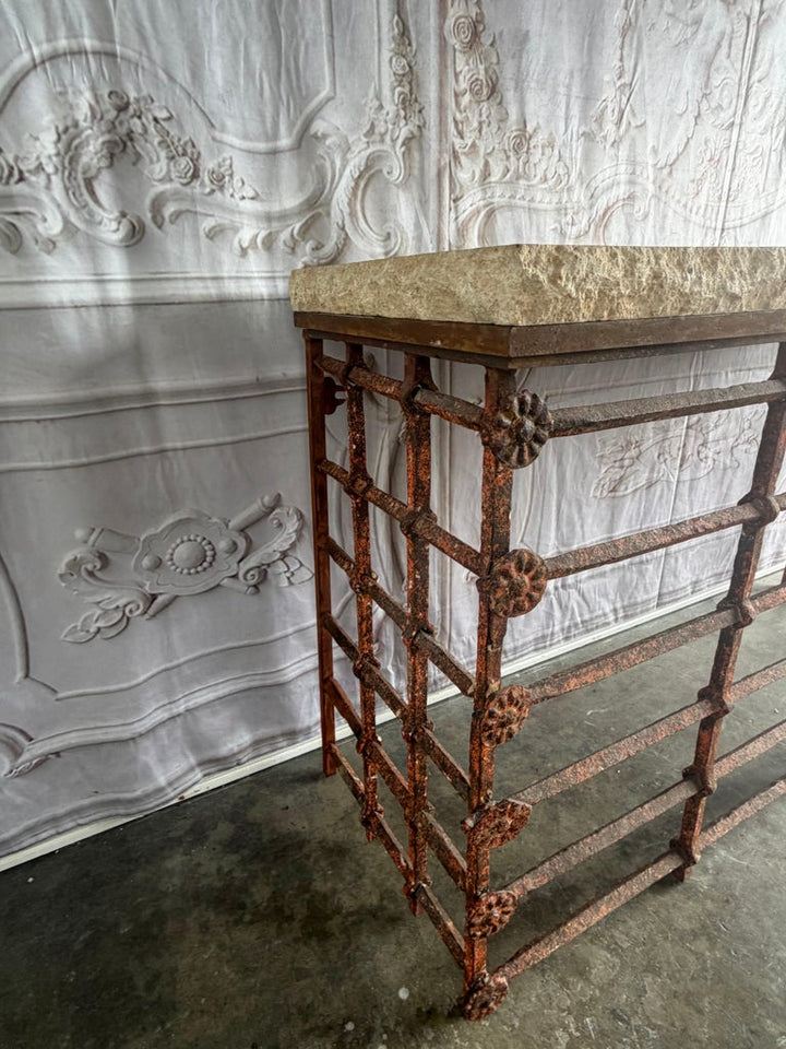 Rustic Console Table with Textured Stone Top and Hand-Forged Iron Base