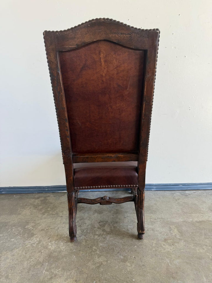 Set of Eight Spanish Revival Leather and Carved Walnut Dining Chairs