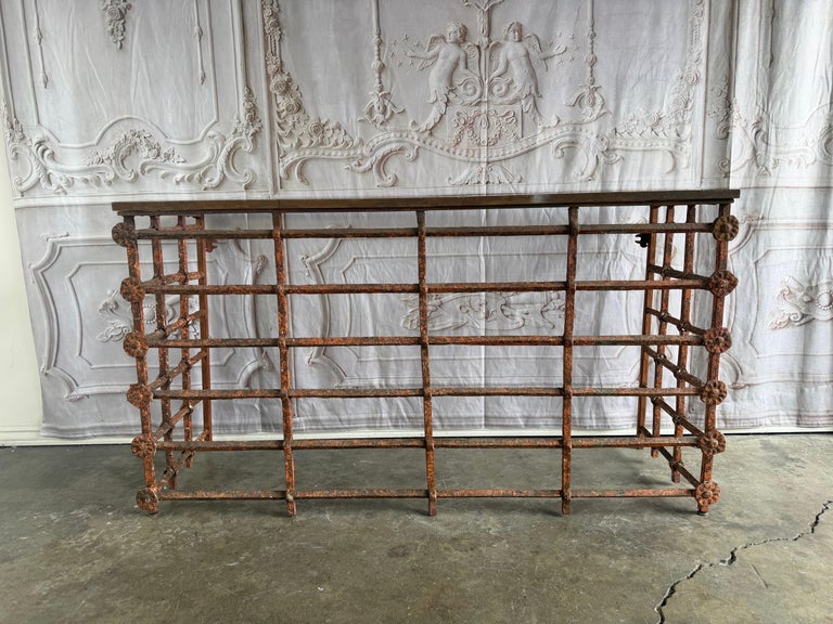 Rustic Console Table with Textured Stone Top and Hand-Forged Iron Base