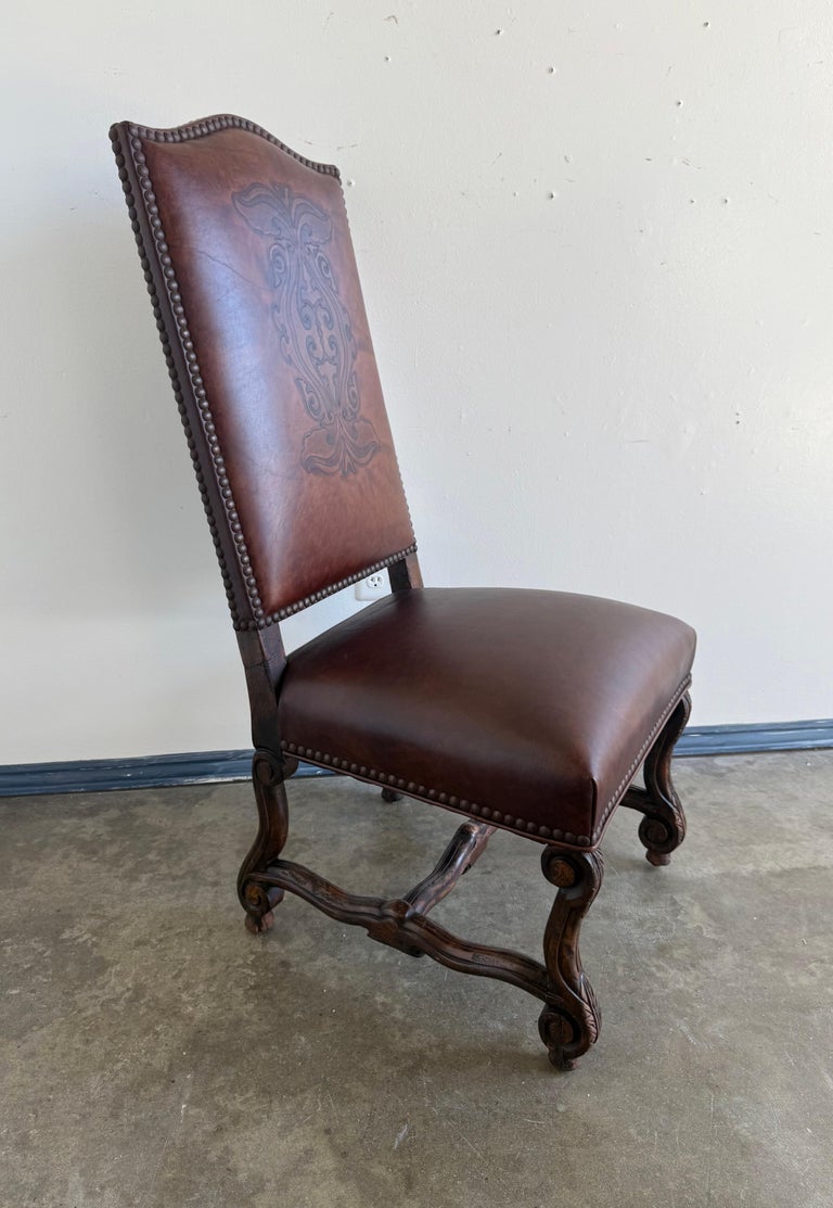 Set of Eight Spanish Revival Leather and Carved Walnut Dining Chairs