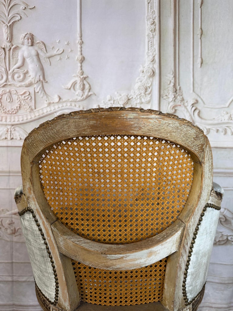 Antique French Louis XVI Style Painted Bergère Chair with Cane Back