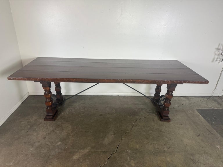 Monumental Spanish Revival Style Walnut Trestle Dining Table with Hand-Hewn Top