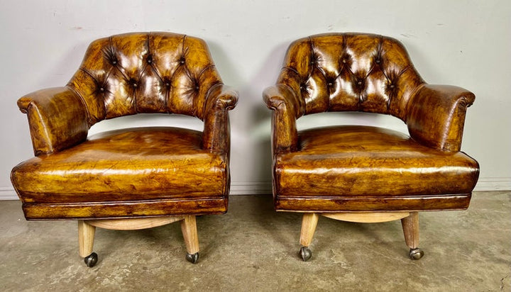 Pair of Mid-Century Leather Tufted Armchairs on Swivels