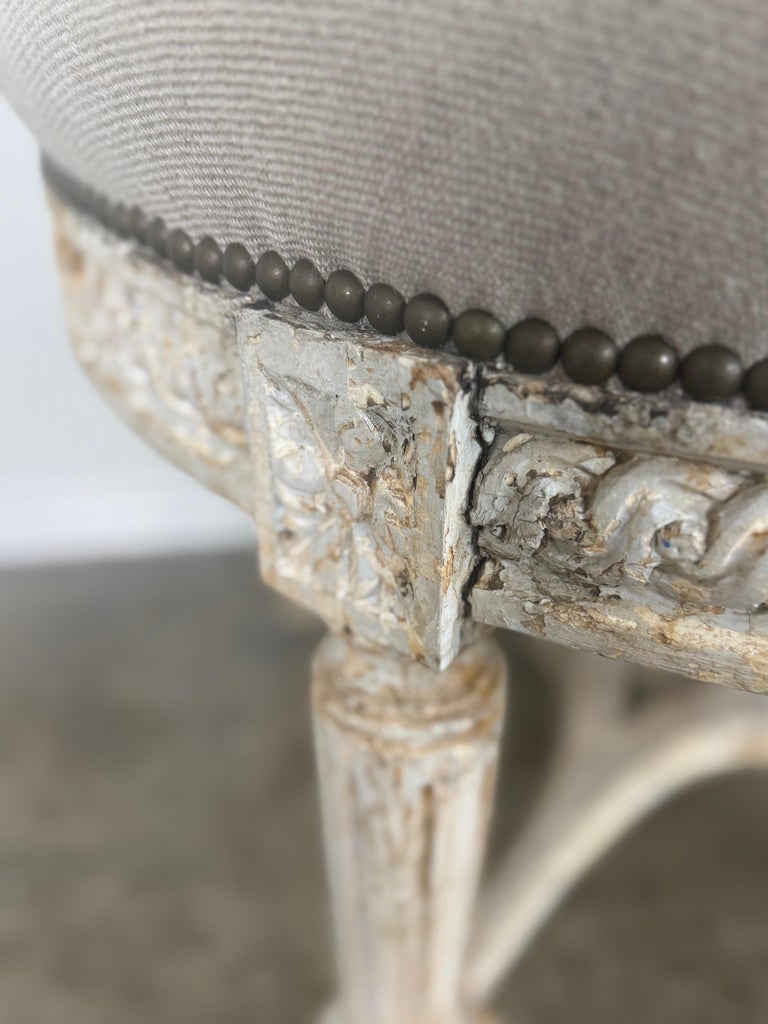 French Neoclassical upholstered ottoman, early 20th century.