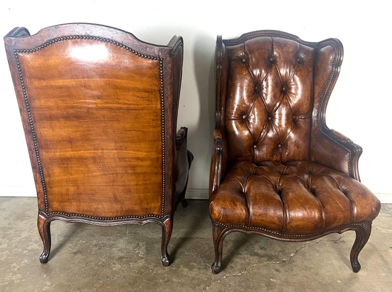 Pair of French Leather Tufted Wingback Chairs C. 1930