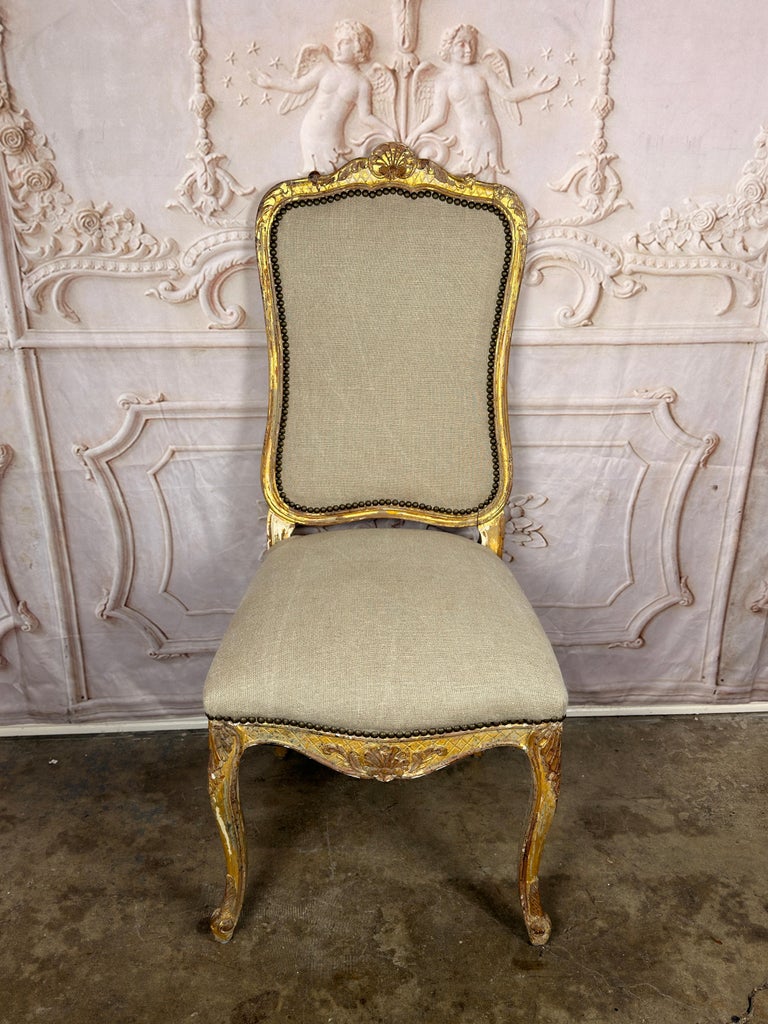Set of 14 French Louis XV Style Gilt Dining Chairs with Linen Upholstery