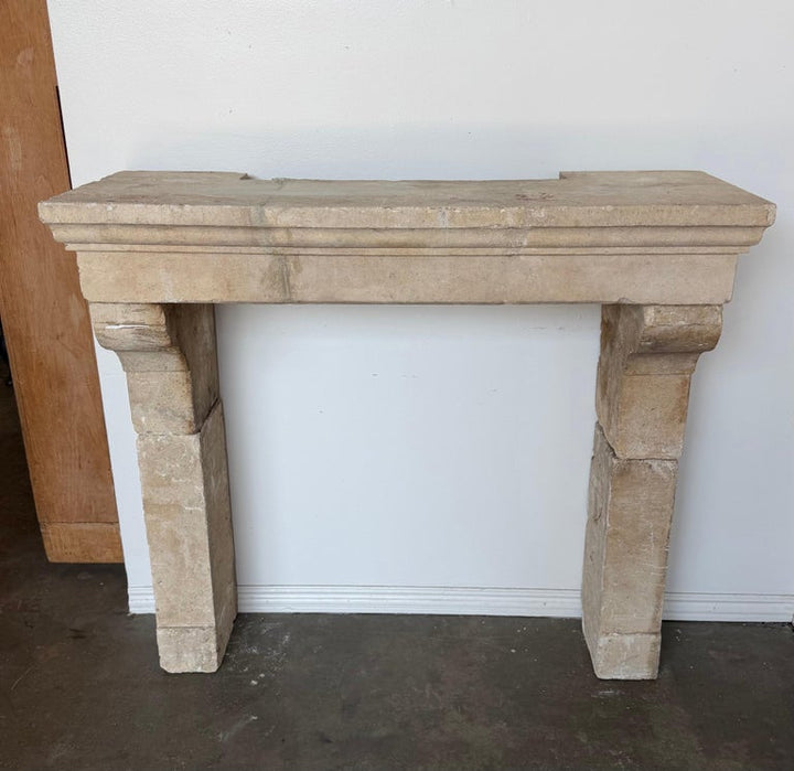 Petite 18th Century French Limestone Fireplace Mantel With Scrolled Corbels