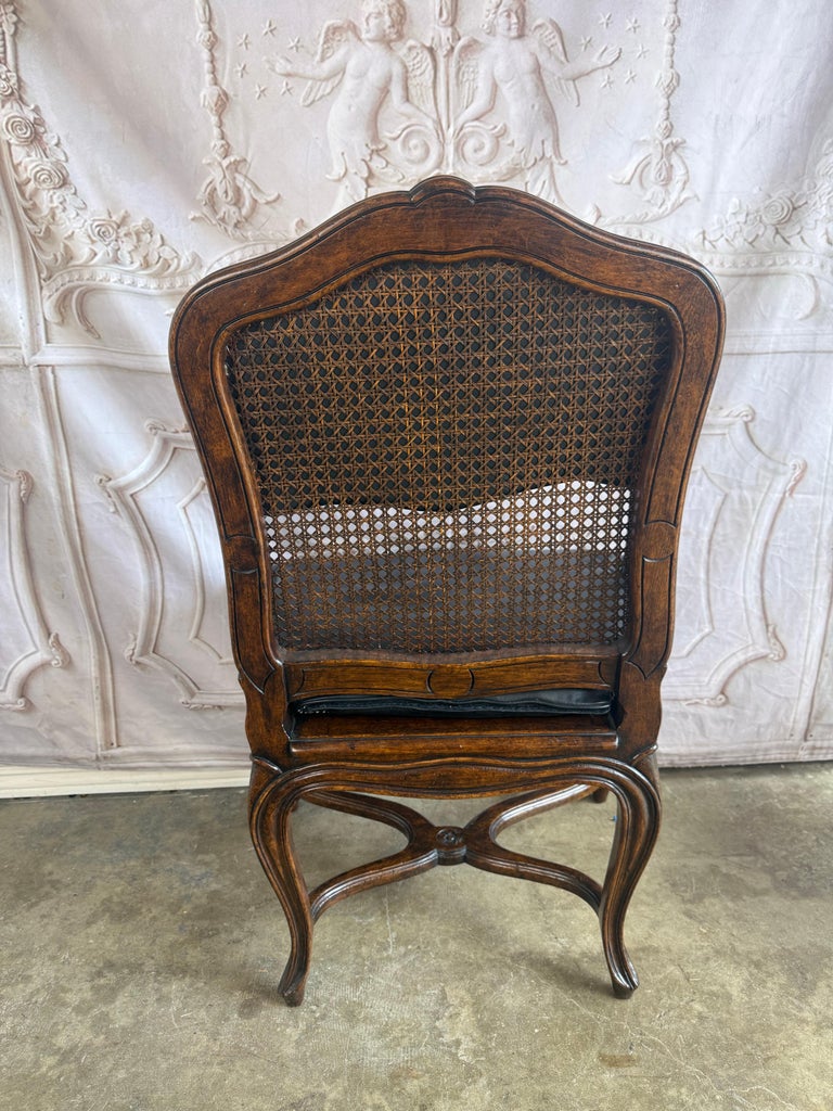 Eight French Provincial-style dining chairs