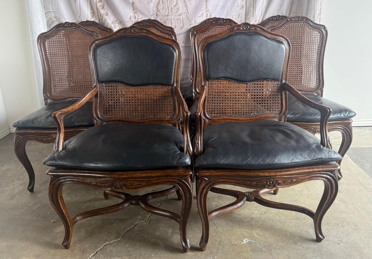 Eight French Provincial-style dining chairs